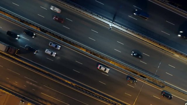 Traffic on night highway. Road intersection view from above.