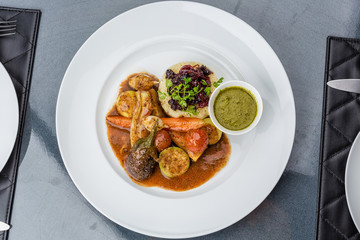 Steamed vegetables with mashed potatoes and sauce