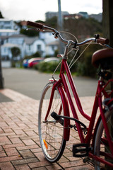 Fototapeta na wymiar Retro Red Bike In City
