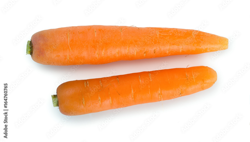 Wall mural pair of fresh, ripe carrots isolated on white background, top view.