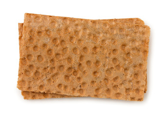 Two plates of crispbread isolated on white background, top view.