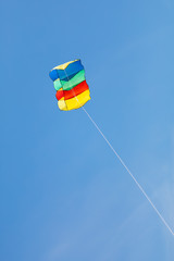 colorful kite on blue sky background