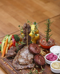 grilled meat, sausage and vegetables