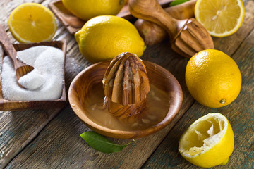 Lemons and squeezer .