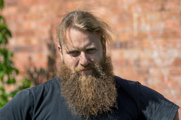 A good-natured portrait of a man with a beard.