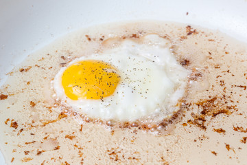 breakfast frying eggs bacon raw cooked stove top