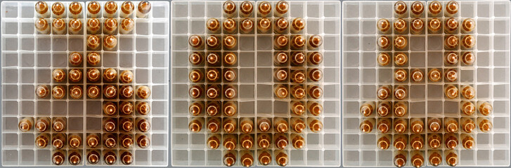 308 caliber sign composed with rifle rounds on ammo trays