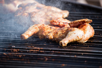 Pickled chicken fried on a large barbecue