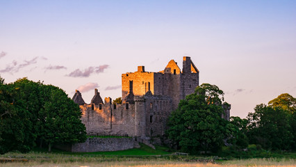 The ruins of Craigmillar Castle at sunset in the outskirts of Edinburgh. Scotland, UK