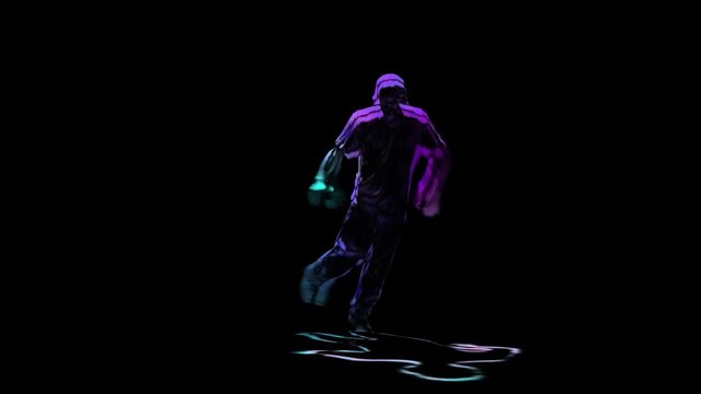 Neon shadow breakdancer man performs on black background. Computer processing