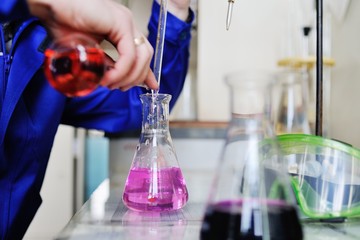 Laboratory scientist working at lab with test tubes