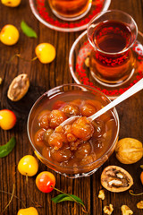 Cherry Jam with Nuts. Azerbaijan Cuisine White Cherry Preserves. Selective focus.