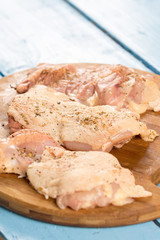 Raw chicken drumsticks prepared with spices for barbecue