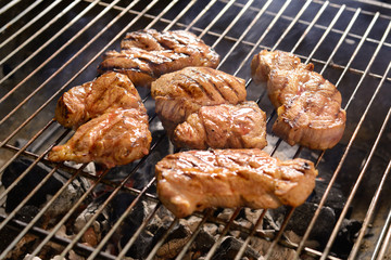 Grilled meat/steak on a grill with smoke