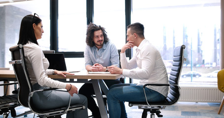 Startup Business Team At A Meeting at modern office building