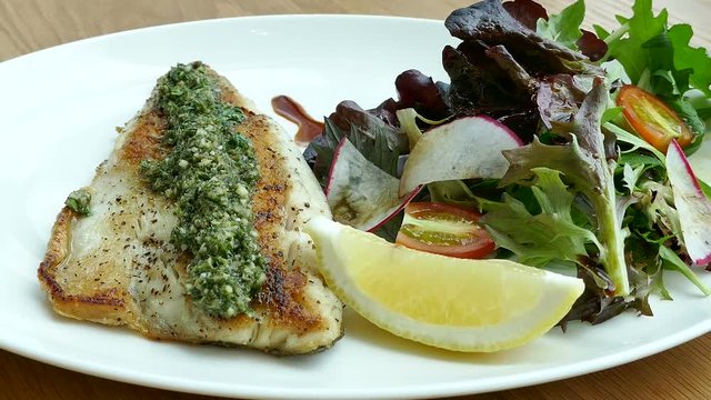 Sea bass steak with sauce
