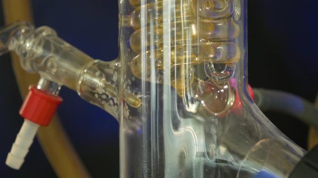 Spiral in a medical flask. Adaptation for medical experiments. spiral glass bulb or flask transport liquid