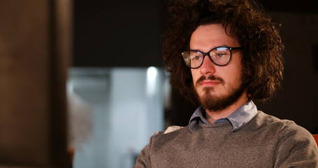 man working on computer in dark office