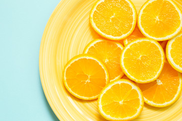 fresh orange on yellow plate