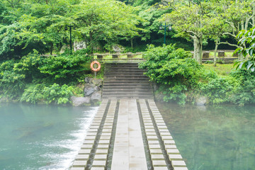 Fototapeta na wymiar Garden Park at Cheonjiyeon Waterfalls in Jeju Island