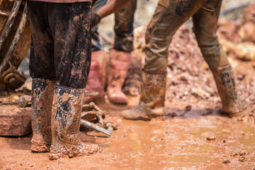 Worker installing wet-process bored pile for outside public construction