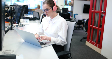 businesswoman using a laptop in startup office