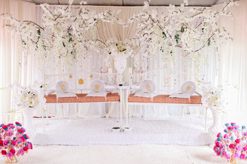 A twin marriage dais for two wedding couples