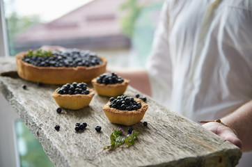 A board with cupcakes and blueberry pie. Collection