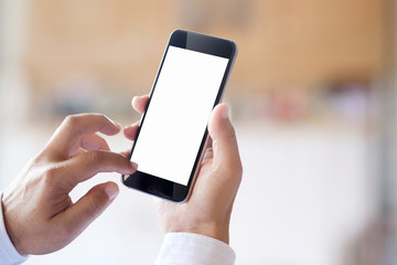Man using smartphone at abstract blurred street night. Blank screen for graphics display montage.