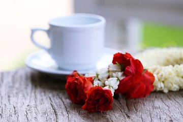 Thai style of jasmine garland with fabric pattern closeup on wooden table background. Thai traditional of mother's day