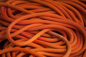 Rolgordijnen Orange rope for climbing. © zhukovvvlad