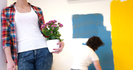 happy young couple doing home renovations