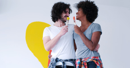 couple with painted heart on wall