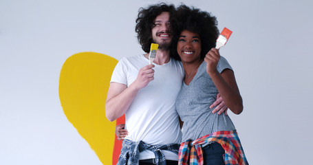 couple with painted heart on wall