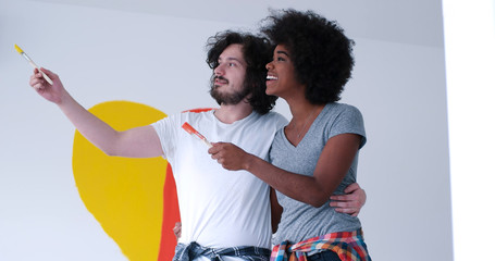 couple with painted heart on wall