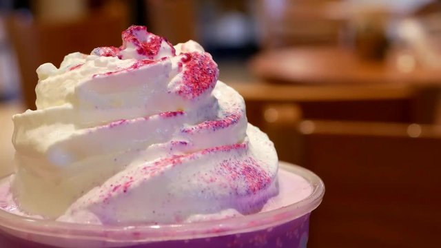 Close up limited edition unicorn frappuccino blended beverage on table 