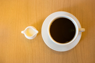 A cup of condensed milk and coffee