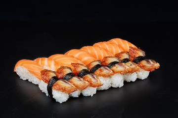 Sushi on black background. Perfect for creating sushi restaurant menu. Part of series.