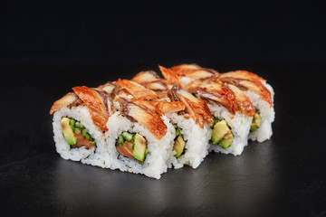 Sushi on black background. Perfect for creating sushi restaurant menu. Part of series.