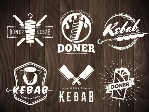 Doner kebab logos. Vector kebab badges with traditional eastern grill dishes on the wooden background. Vintage labels for restaurant or bar.