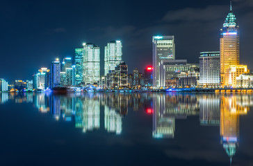 Fototapeta premium Illuminated City At Waterfront in city of China.