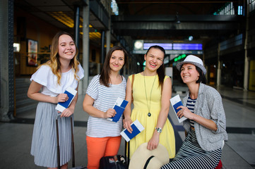 Charming tourists rejoice to the beginning of a travel.