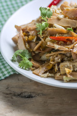 Spicy Fried Bamboo Shoot on Wooden table.