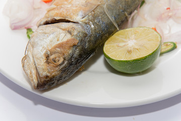 Fried dried salted mackerel fish with flavoring spicy isolated on white