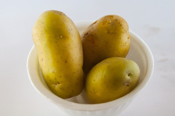 New potato isolated on white background close up