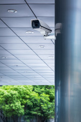 detail shot of CCTV security camera hanging on column