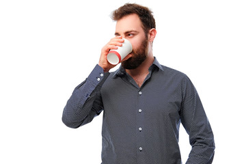 A man holds paper coffee glass.