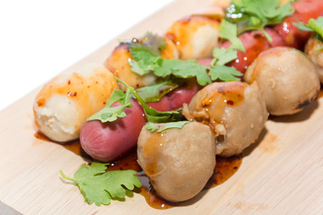 grilled meatball with sauce on white background