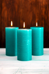 three lighted candles