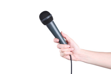 Female hand holding microphone on white background